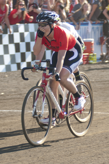 Brenna McGinn puts her hand to face after leading Kappa Alpha Theta to the finish line in first place during the women\'s Little 500 at Bill Armstrong Stadium in Bloomington, Friday, April 25, 2014.
