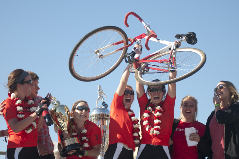 Brenna McGinn, holding the winner\'s trophy, and her teammates celebrate winning the women\'s Little 500 at Bill Armstrong Stadium in Bloomington, Friday, April 25, 2014.