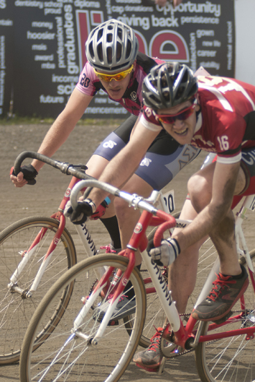 Riders from Delta Sigma Pi (20) and Dodds House (16) race into turn four during the men\'s Little 500 at Bill Armstrong Stadium in Bloomington, Saturday, April 26, 2014.