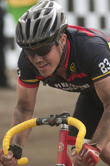 A rider for Pi Kappa Phi races through the front straightaway during the men\'s Little 500 at Bill Armstrong Stadium in Bloomington, Saturday, April 26, 2014.