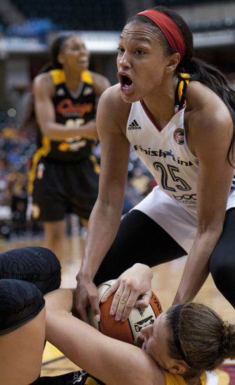 Fever forward Marissa Coleman yells for a jump-ball call as Shock forward Jordan Hooper tries to hold onto the ball during the Indiana Fever\'s 107-102 overtime loss to the Tulsa Shock at Bankers Life Fieldhouse, Wednesday, June 25, 2014.