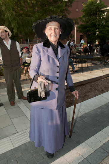 Cheryl Fesmire is dressed as Jennie Ralston, the first lady of Indianapolis in 1913, during the Omni Severin Hotel\'s 100th anniversary party on Georgia Street, Friday, August 23, 2013.