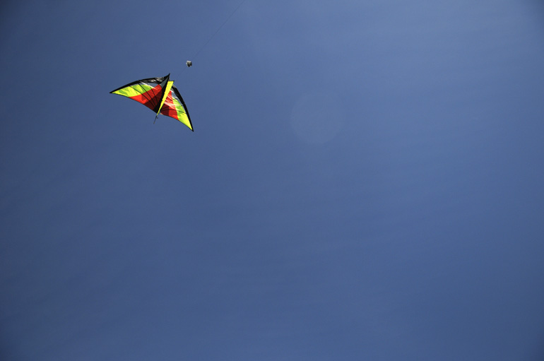 Kite and camera on a pure blue background. Who could ask for anything more?
