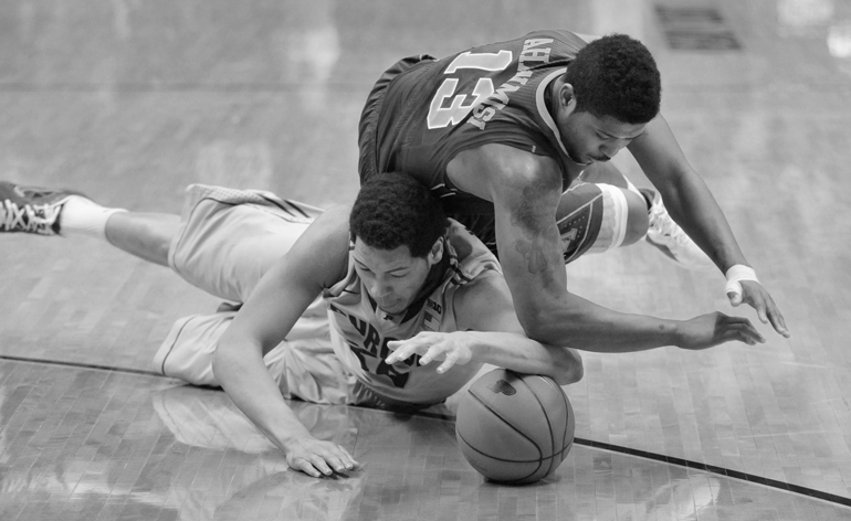 Purdue center A.J. Hammons fights for a loose ball with Minnesota guard Maverick Ahanmisi during an 89-73 victory over the Golden Gophers on Senior Day, Saturday, March 9, 2013, at Mackey Arena in West Lafayette, Ind.