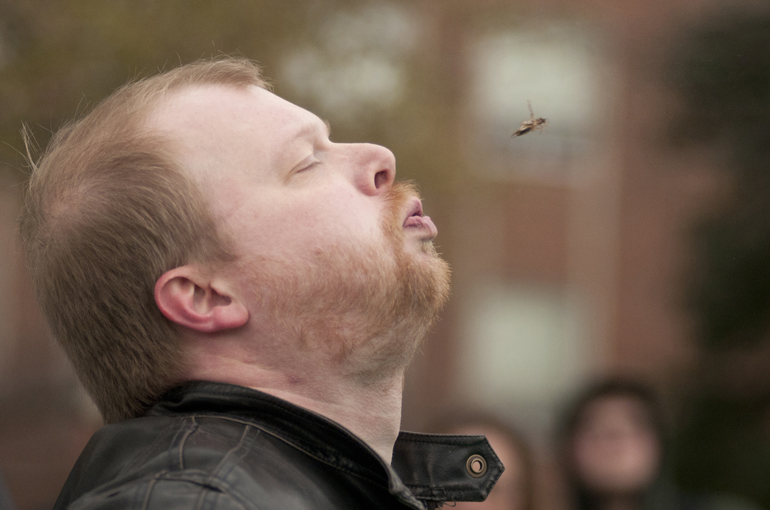 Jared Barker spits a cricket for distance during the cricket spitting competition at Purdue University\'s Bug Bowl on Saturday, April 13, 2013, on the Purdue campus in West Lafayette, Ind. The contest, sanctioned by Guinness World Records, debuted in 1997.