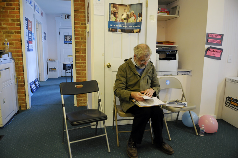 Bob Gunn, of Wales, checks his get-out-the-vote list on Election Day.