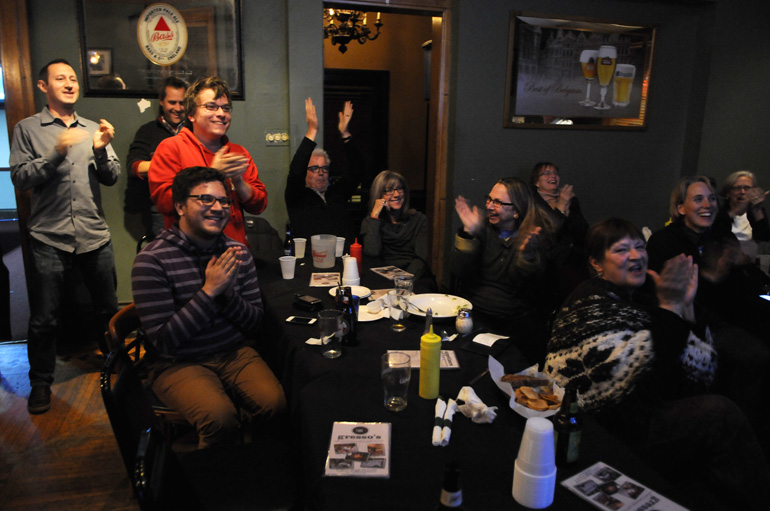 Obama campaign volunteers cheer as cable news channel MSNBC calls Ohio for President Obama.