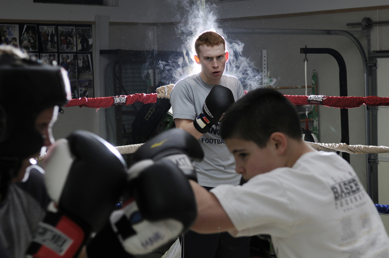 Lafayette Boxing Club\'s Tate Sturgeon watches as Kate Mane and Kyle Siple trade light jabs during a workout Tuesday, March 5, 2013, at the club building in Lafayette. Sturgeon and Mane, along with Luis Pena, Conan Hutchison and other boxers, will compete at the Indiana Golden Gloves tournament on March 23 in Indianapolis.
