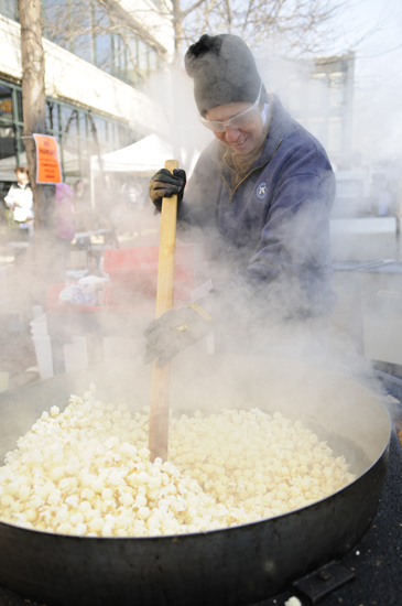 Nancy Strack, co-owner of LongHouse Farm, stirs kettle corn as it pops during the Mini Farmers Market on Saturday, March 30, 2013, in Lafayette. The full Historic Lafayette Farmers Market begins at Purdue on May 2 and in downtown Lafayette on May 4.