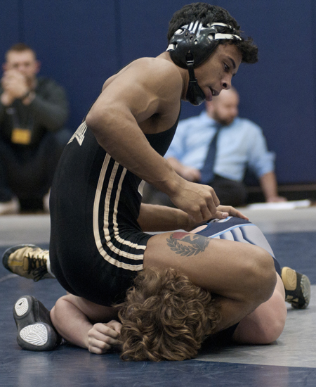 Trent Pruitt of Warren Central gains the upper hand over Noah Warren of Perry Meridian in the 145 lbs. championship match during a high school wrestling regional meet at Perry Meridian High School, Saturday, Feb. 7, 2015.