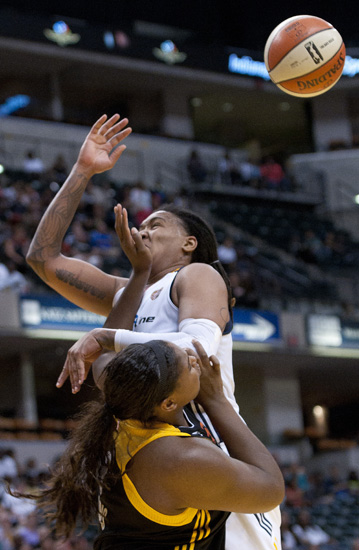 Shock center Courtney Paris hits Fever forward Erlana Larkins in the face during the Indiana Fever\'s 107-102 overtime loss to the Tulsa Shock at Bankers Life Fieldhouse, Wednesday, June 25, 2014.