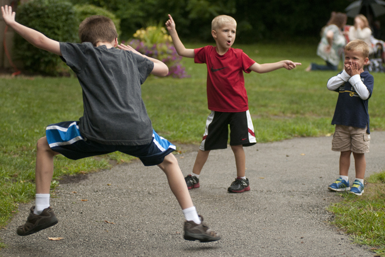 (From left) Lucas Reiberg, 7, Owen King, 5, and Colt Siner, 3, dance while Zanna-Doo plays during a Greenwood Summer Concert Series event at the Greenwood Amphitheater, Saturday, July 20, 2013.