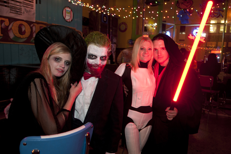 People dress in costume for a Halloween party at Tin Roof, Thursday, Oct. 31, 2013.
