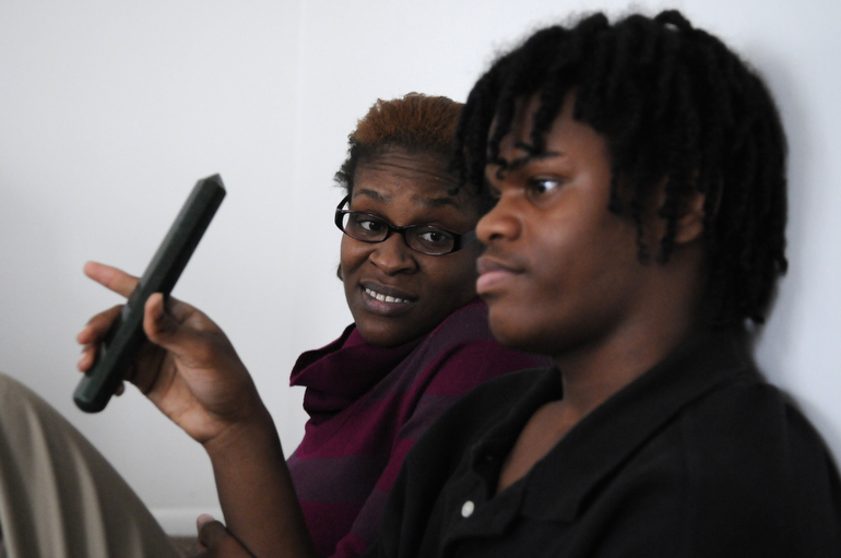 Levia Heffner talks to her son, Jalen, 14, as he introduces himself during a Peace Learning Center family session.