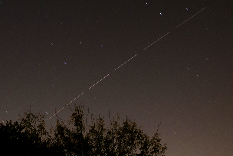 The International Space Station travels for three minutes over Indianapolis in six 30-second exposures.