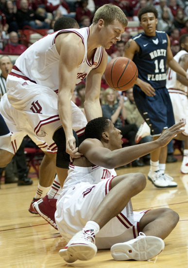 Hoosier forward Austin Etherington helps up Hoosier forward Troy Williams after Williams\' basket during IU\'s 89-68 victory against the University of North Florida at Assembly Hall in Bloomington, Saturday, Dec. 7, 2013.