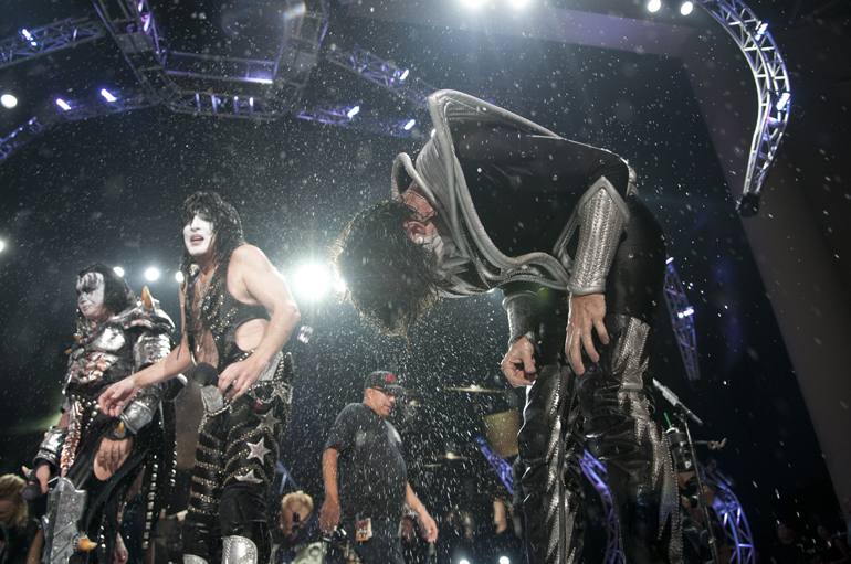 Tommy Thayer of KISS whips ice water out of his hair after the band and Def Leppard did the ALS ice bucket challenge at Klipsch Music Center, Friday, Aug. 22, 2014. The bands each pledged $10,000 to the ALS Association and challenged music acts such as Elton John, U2 and Prince.