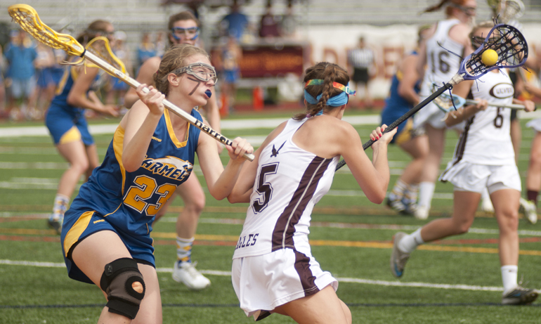 Carmel defender Graylynn Oatess defends against Culver midfielder Annie Morsches during Culver\'s 9-8 victory over Carmel in the Indiana Girls Lacrosse Association state championship at Brebeuf Jesuit Preparatory School in Indianapolis, Saturday, June 1, 2013. (Alex Farris / For The Star)