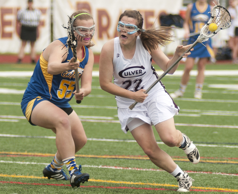 Carmel defender Madeline Engledow tries to keep Culver attacker Saralena Barry from scoring a goal during Culver\'s 9-8 victory over Carmel in the Indiana Girls Lacrosse Association state championship at Brebeuf Jesuit Preparatory School in Indianapolis, Saturday, June 1, 2013.