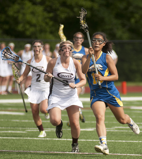 Culver defender Haillie Benn chases Carmel midfielder Sohee Kwon during Culver\'s 9-8 victory over Carmel in the Indiana Girls Lacrosse Association state championship at Brebeuf Jesuit Preparatory School in Indianapolis, Saturday, June 1, 2013.