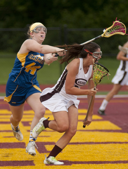 Carmel attacker Sophie Kelner swipes toward Culver attacker Olivia Rabbitt during Culver\'s 9-8 victory over Carmel in the Indiana Girls Lacrosse Association state championship at Brebeuf Jesuit Preparatory School in Indianapolis, Saturday, June 1, 2013.