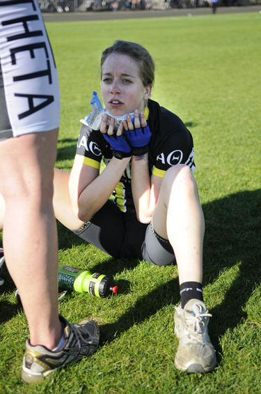 Sophomore Kappa Alpha Theta rider Rachel Metherd sits in the infield with an ice pack. Metherd said she does not remember the middle five laps of her team's heat.