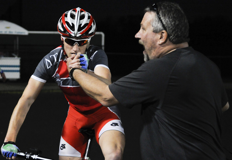 Senior Delta Tau Delta rider R.J. Stuart and coach Ken Nowakowski celebrate winning the Little 500 Team Pursuit final on Saturday at Bill Armstrong Stadium. Delta Tau Delta beat the Cutters by a recorded tenth of a second to reach the final, where they beat Sigma Chi.