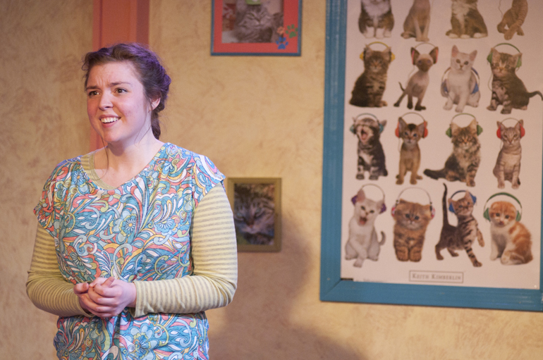 Katherine Shelton (Caroline) records a speech for class in front of a cat poster in her bedroom during playwright Lauren Gunderson\'s \
