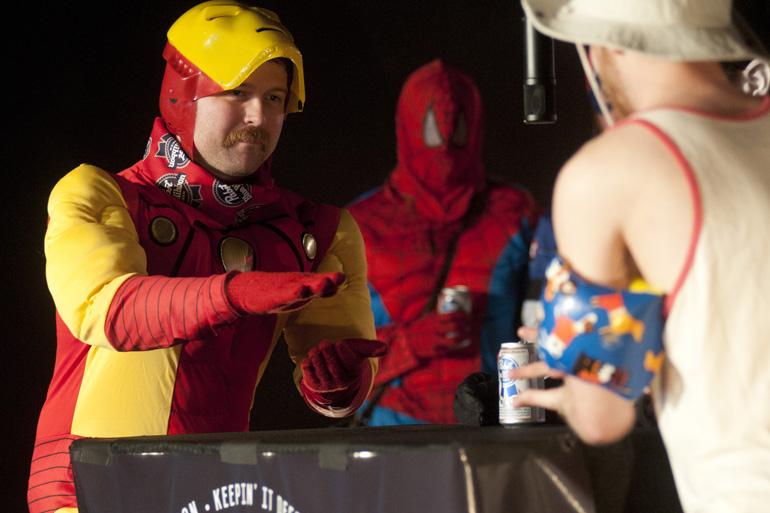 Matt Reichman (dressed as Ironman) plays paper during the first Rock Paper Scissors Indy City Championship at the White Rabbit in Fountain Square, Saturday, May 31, 2014. Teams of three filled a bracket of 32 teams and battled for a top prize of $500.