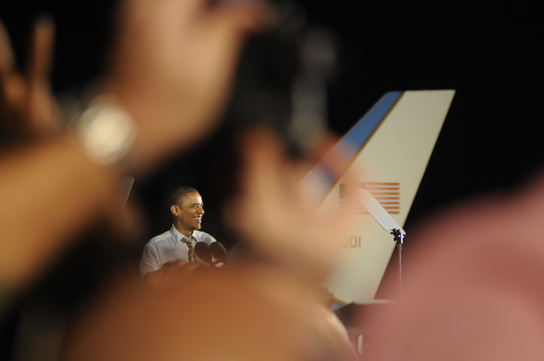U.S. President Barack Obama smiles at the crowd gathered at Burke Lakefront Airport in Cleveland, Ohio, during the last stop on his two-day campaign swing.