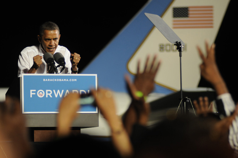 President Barack Obama makes a forceful point to an estimated 12,000 people at Burke Lakefront Airport in Cleveland during the last stop on his two-day cross-country campaign swing, Thursday, October 25, 2012. Before Cleveland, Obama flew to Chicago, where he cast his early vote.