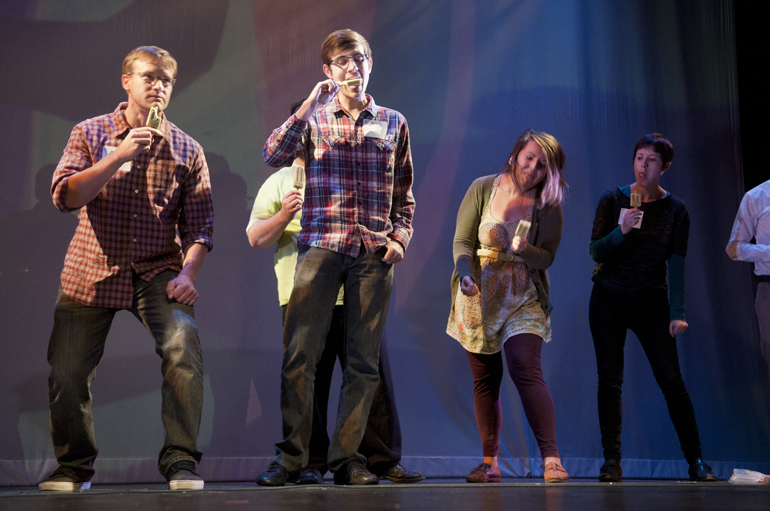 Audience members participate in a popsicle-eating contest during Optical Popsicle, an annual variety show by the collective Know No Stranger, at The Toby Theatre at the Indianapolis Museum of Art, Saturday, Oct. 11, 2014.