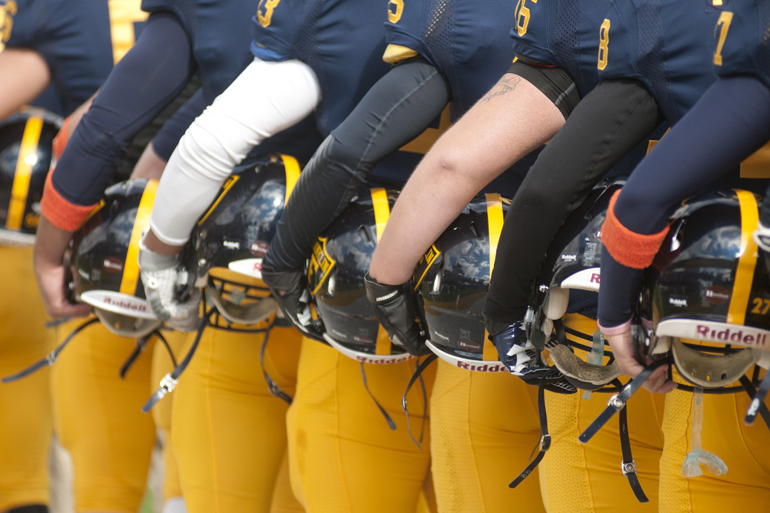 Franklin College players face the flag during the national anthem before their football game against Anderson University in Franklin, Saturday, Oct. 19, 2013. Franklin\'s \