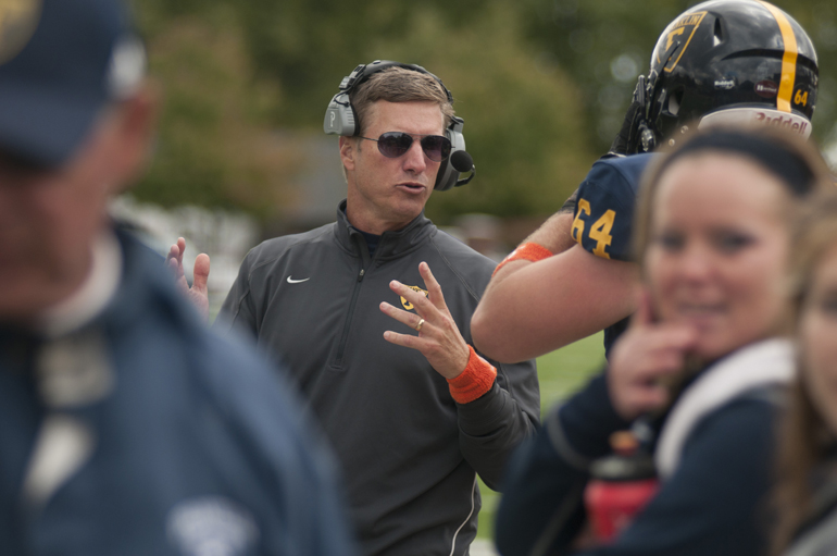 Head coach Mike Leonard talks with his players during Franklin College\'s football game against Anderson University in Franklin, Saturday, Oct. 19, 2013. Franklin\'s \
