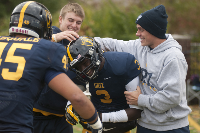 Injured wingback Jonny Hession (right) congratulates wide receiver Leon Williams for his touchdown during Franklin College\'s football game against Anderson University in Franklin, Saturday, Oct. 19, 2013. Franklin\'s \