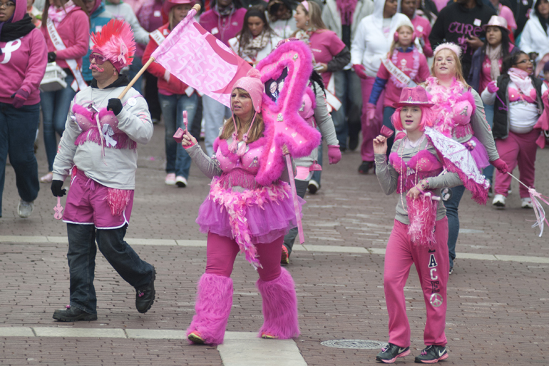 Members of the Pickering family walk around Monument Circle during the Making Strides Against Breast Cancer 5K walk downtown, Saturday, Oct. 26, 2013.