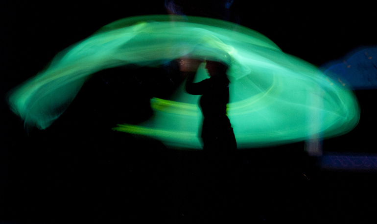 Heidi Shackleford twirls a glow-in-the-dark ghost puppet during Peewinkle Puppet Studio\'s annual adult show in Indianapolis, Friday, June 7, 2013.