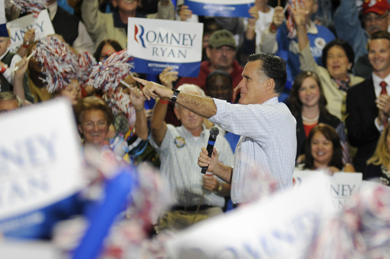 Former Mass. Governor Mitt Romney points to the crowd at the start of his speech during a presidential campaign stop Sept. 26 in Toledo, Ohio.