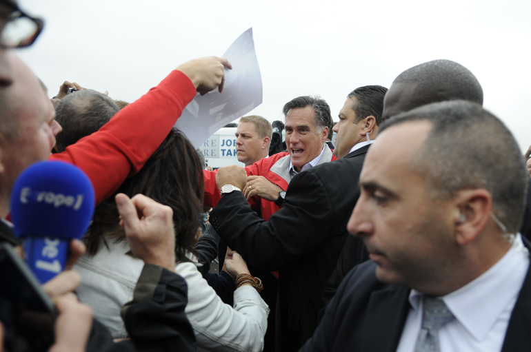 Former Mass. governor Mitt Romney thanks supporters during a Romney/Ryan presidential campaign stop Sept. 25 at Dayton International Airport Exposition Center in Ohio.
