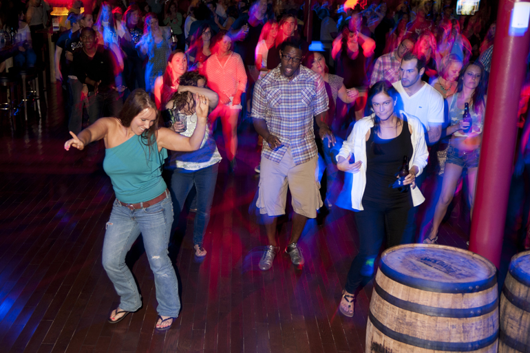 People enjoy a night at Saddle Up Saloon & Dancehall in Castleton, Friday, May 31, 2013.