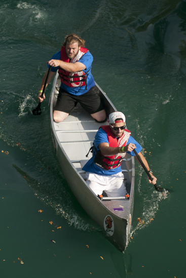 Cool Rowings leads the first heat of the IUPUI Regatta in the Downtown Canal, Saturday, Sept. 20, 2014. In the regatta, teams race up and down the canal from the head at Fairbanks Hall to the Walnut Street basin and back. Two of a team\'s four rowers paddle from the start line, then exchange the canoe with the other two team members at the basin.