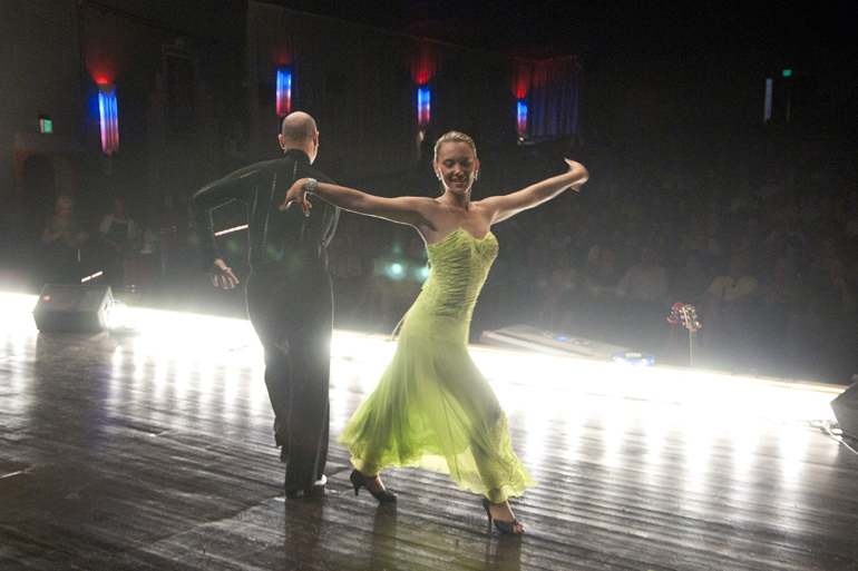 Arthur Murray Studio dancers Tony Crosby and Leah Drobat open the Dancing with the Johnson County Stars charity fundraiser at the Historic Artcraft Theatre in Franklin, Friday, Sept. 26, 2014.