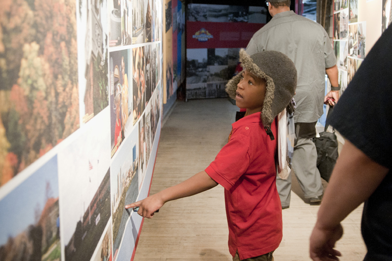 Jaiden Ssali, 7, points out a picture of Indianapolis in the Bicentennial Train during National Train Day celebrations at Union Station, Saturday, May 10, 2014.
