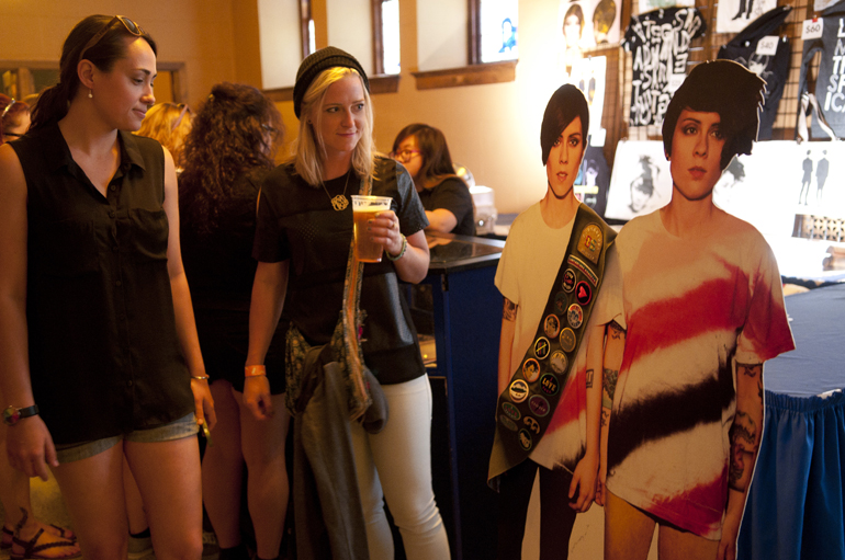 Jacquelyn Halpern and Jenna Cook check out a cardboard cutout of Tegan and Sara before their concert at Old National Centre, Saturday, May 10, 2014.