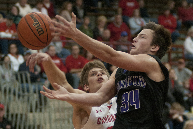 Southport junior Luke Johnston knocks the ball away from Brownsburg sophomore Landon Hall during a game between Brownsburg and Southport at Southport High School Fieldhouse, Saturday, Nov. 29, 2014.